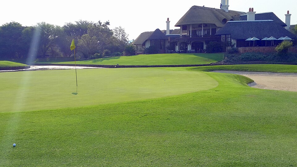 The 9th green and clubhouse at Leopard Creek in Malalane.
